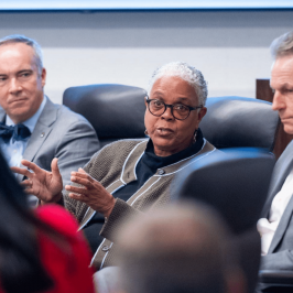 woman-speaks-at-meeting-source2